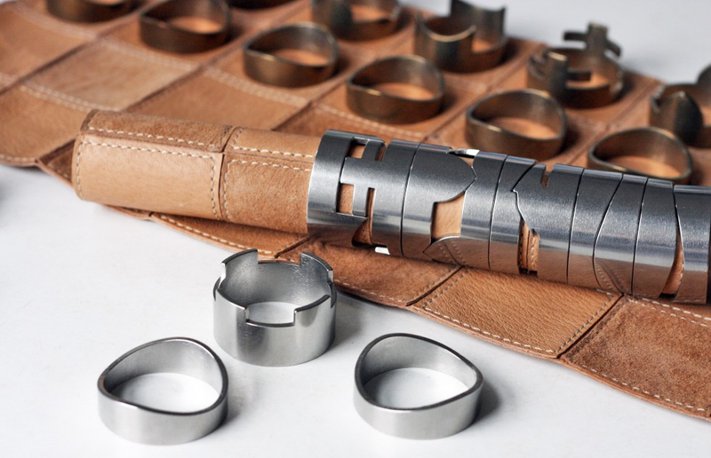 Illustration for article titled Stackable Chess Pieces Hide a Rolled Up Leather Board Inside
